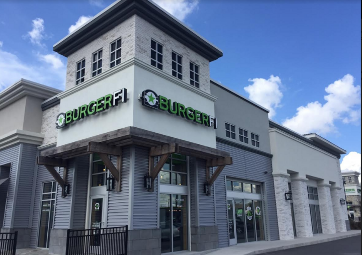 Exterior of a BurgerFi restaurant at daytime, where there are soon to be BurgerFi fundraisers