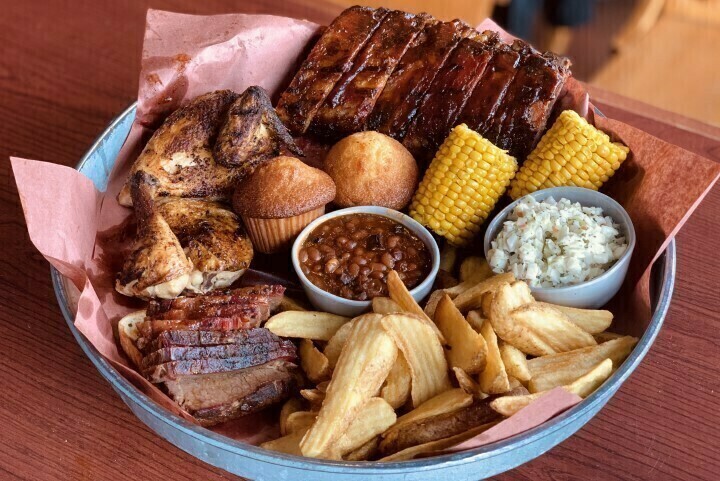 Plate of barbecue meat, beans, and more, all available at Famous Dave's fundraisers